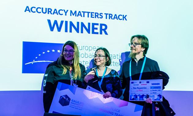 The winning team receiving their prize.