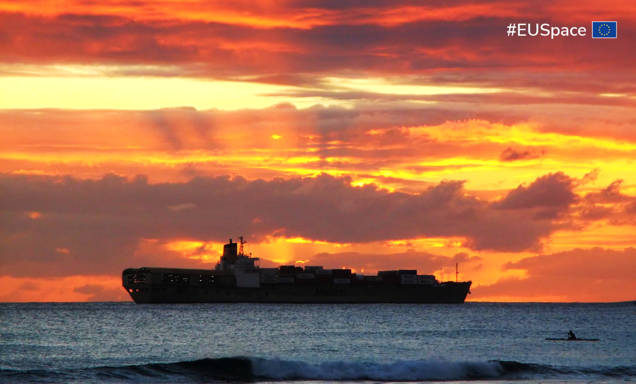 cargo ship on the sea at sunset