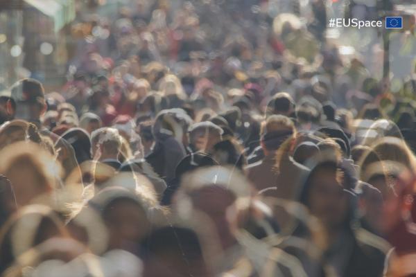 Crowd of people walking in a city