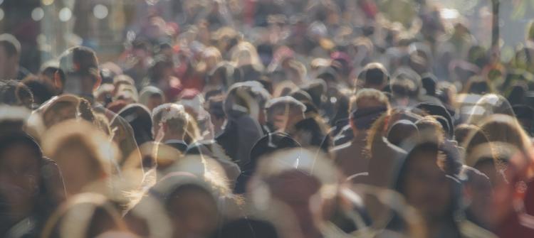 Crowd of people walking in a city