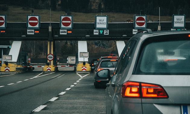 Under what conditions would it be beneficial to implement an EGNOS service for payment and liability-critical road applications in 2025-2035? 