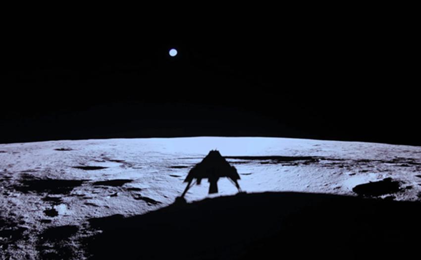 The Blue Ghost 1 lander silhouetted against the lunar surface after touching down on the Moon, with Earth visible in the dark sky above.